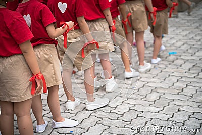 Uniformed children aligned legs Stock Photo