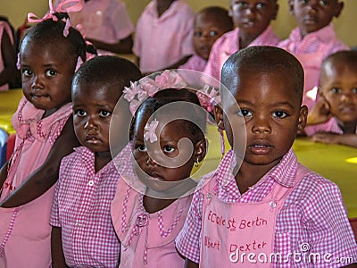 Uniformed in pink kindergartners in rural Haiti. Editorial Stock Photo