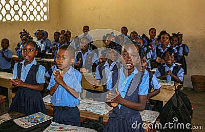 Uniformed school children are delighted to greet medical missionaries to their classroom in Haiti. Editorial Stock Photo