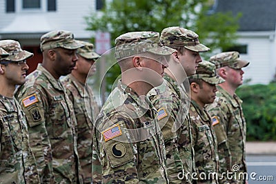 Uniformed soldiers in USA army diverse colors men walk in formation Editorial Stock Photo