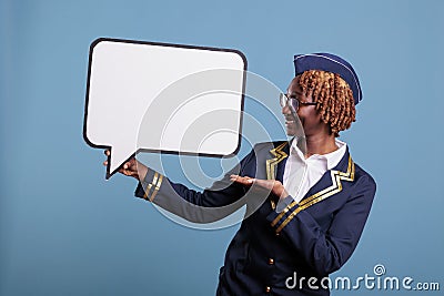 Uniformed stewardess holding dialogue window Stock Photo