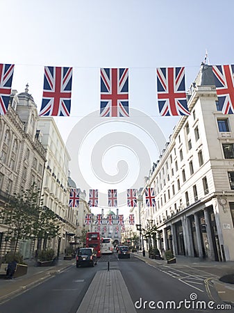 Union flags on display along Waterloo Place in London Editorial Stock Photo