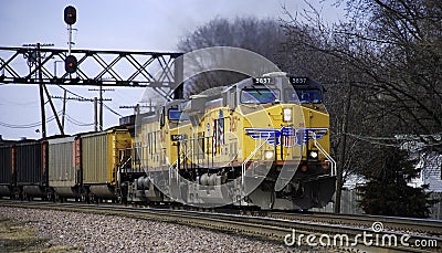 Union Pacific double header pulls a coal train under the signal bridge Editorial Stock Photo