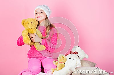 Unique attachments to stuffed animals. Child small girl playful hold teddy bear plush toy. Teddy bears improve Stock Photo