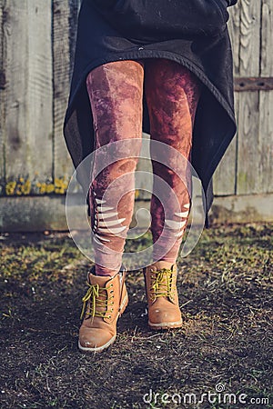 Unique colorful tights, girl legs, walking ir rocky village Stock Photo