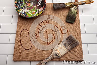 Unique creative life sign with paintbrushes Stock Photo