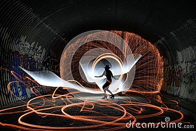 Unique Creative Light Painting With Fire and Tube Lighting Stock Photo