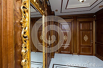Unique exclusive wooden furniture doors mirror in hallway Stock Photo
