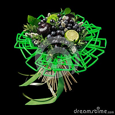 Unique gift handmade in the form of bouquet of flowers and fruits decorated with many green straws for drinks on a black backgroun Stock Photo