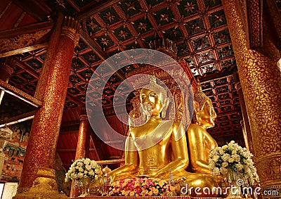 Unique and Gorgeous Golden Four-sided Seated Buddha Images of Wat Phumin Temple, Famous Buddhist Temple in Nan Province, Thailand Stock Photo