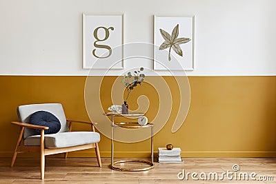 Unique living room in modern style interior with design armchair, elegant gold coffee table, mock up poster frames, flowers. Stock Photo