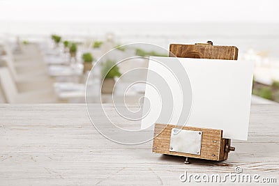 Unique mockup menu frame on table over blurred restaurant interior Stock Photo