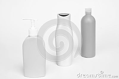 Unique packaging. Toiletry bottles isolated on white. Shampoo, conditioner and lotion bottles in row Stock Photo