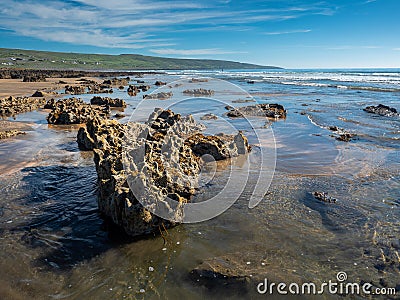 Unique rocks on Fanore beach, county Clare, Ireland, Sunny day, Cloudy blue sky, Atlantic ocean, landscape. Nobody Stock Photo