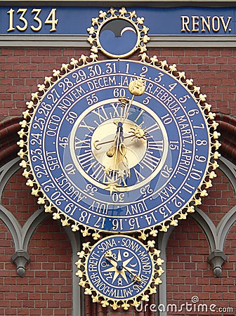 The big clock-calendar on the Blackhead`s house in Old Town of Riga, Latvia Stock Photo