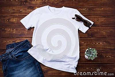 Unisex T-shirt mockup with jeans and succulent Stock Photo