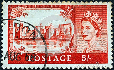 UNITED KINGDOM - CIRCA 1955: A stamp printed in United Kingdom shows Caernarfon castle and queen Elizabeth II, circa 1955. Editorial Stock Photo