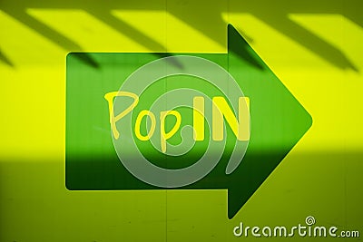 UNITED KINGDOM, LANCASTER - 9TH APRIL 2020 Arrow pop in shop sign in green and yellow Stock Photo