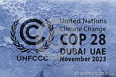 The United Nations Flag, logo of Climate Change UNFCCC on a grungy cracked wall. COP 28 Dubai, UAE Editorial Stock Photo