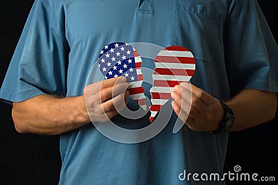 United States citizen with broken heart over politics social injustice and xenophobic legislators Stock Photo