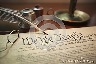 United States Constitution with quill, glasses and candle holder Stock Photo