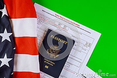 A United States voter registration application with United States Passports on of American Flag Stock Photo