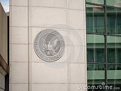 United States Securities and Exchange commission SEC logo on entrance of DC building near H street Editorial Stock Photo