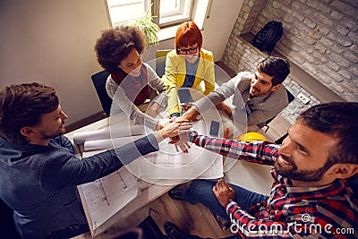 United team in architect office working together Stock Photo