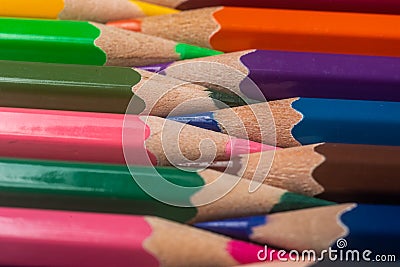 Unity and diversity. Still Life Conceptual - Colored Pencils on isolated backround. Shallow depth of field Stock Photo