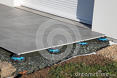 Universal Adjustable Support Pedestals swap paving for outdoor slab tiles Stock Photo