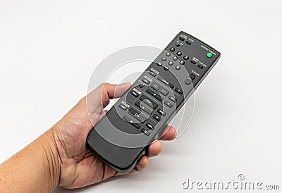 Universal remote control on white. Old and dirty music station remote controller Stock Photo
