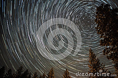 Universe spiraling around north star on night sky Stock Photo