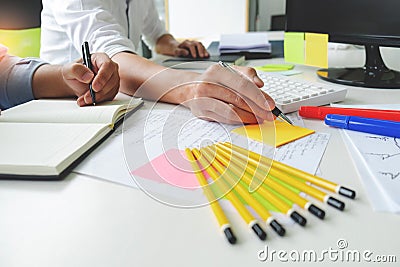 University / college students discussing on homework in classroom, education concept Stock Photo