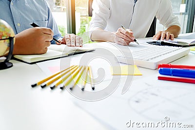 University / college students discussing on homework in classroom, education concept Stock Photo