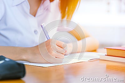 university girl hand writing. teen doing homework Stock Photo