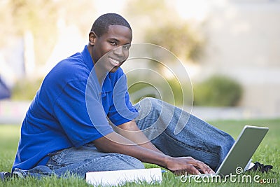 University student using laptop outside Stock Photo