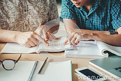 University studying friends studying and reading a books in classroom Stock Photo