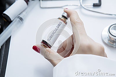 Unknown doctor holds a vial with Tuberculosis word Stock Photo