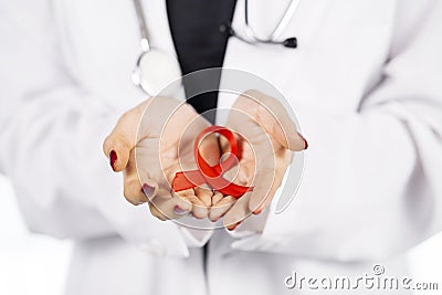 Unknown female doctor holding a red ribbon Stock Photo