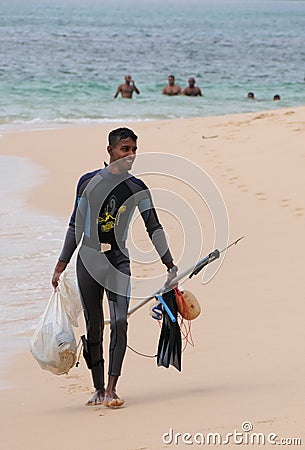 Unknown Lankans returned from spearfishing in the coastal zone of the Indian ocean. Editorial Stock Photo