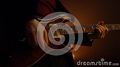 Unknown man hands playing guitar solo in club. Guy musician performing music. Stock Photo