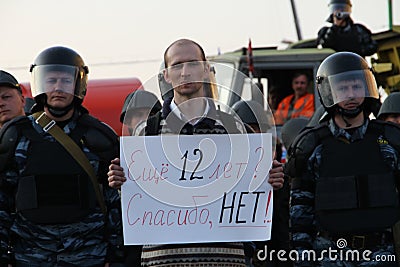 Unknown protester with a poster in the background of police for the shares of Russian opposition for fair elections, may 6, 2012 Editorial Stock Photo