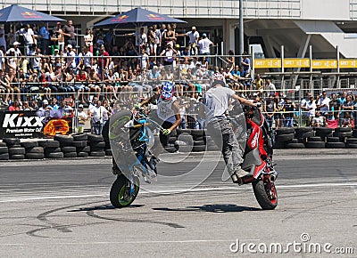 Unknown stunt bikers entertain the audience Editorial Stock Photo