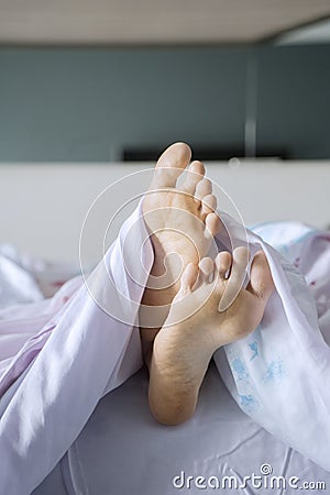 Unknown woman sleeping on the bed Stock Photo