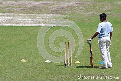 Unknown young cricket player in a training session. Editorial Stock Photo