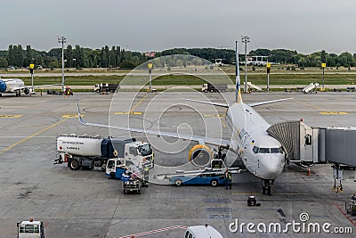 Unloading baggage from a Boeing aircraft after the flight Editorial Stock Photo