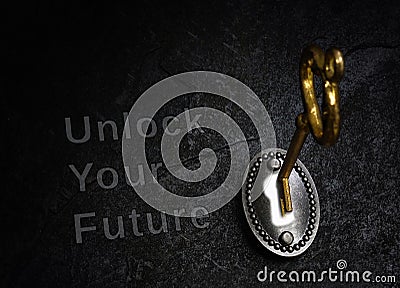Unlock Your Future vintage lock and gold key Stock Photo