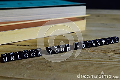 Unlock your potential on wooden blocks. Motivation and inspiration concept Stock Photo