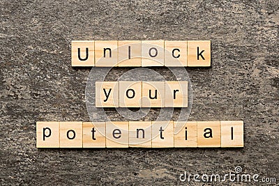 unlock your potential word written on wood block. unlock your potential text on table, concept Stock Photo