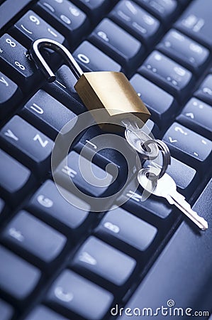 Unlocked metal padlock with keys on blue computer keyboard. Data and password protection, internet and network security concept Stock Photo